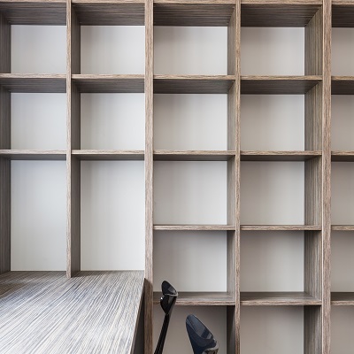 Empty office fitted with bookshelf space